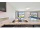 Close-up of a kitchen sink featuring granite countertops and stainless steel appliances at 8034 Broad Pointe Dr, Zephyrhills, FL 33540