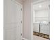 View into the laundry room with washer, dryer, and 'Laundry Room' rug at 8034 Broad Pointe Dr, Zephyrhills, FL 33540