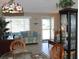 View of the home's living room area shows front door and natural light at 9480 45Th N Way, Pinellas Park, FL 33782