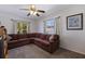 Living room features a comfortable brown sectional couch and natural lighting at 967 43Rd Ne Ave, St Petersburg, FL 33703