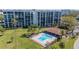 Aerial view showcasing the pool, cabana, and meticulously landscaped grounds of the community at 100 Oakmont Ln # 112, Belleair, FL 33756