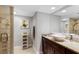 Elegant bathroom features a modern vessel sink, granite countertop, and a glass-enclosed shower at 100 Oakmont Ln # 112, Belleair, FL 33756
