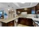 Well-equipped kitchen with modern stainless steel appliances and generous counter space at 100 Oakmont Ln # 112, Belleair, FL 33756