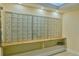 Wall of mailboxes, well-lit and organized, providing convenient mail access at 100 Oakmont Ln # 112, Belleair, FL 33756