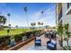 Scenic waterfront patio offers comfortable seating and an outdoor dining area with water views at 100 Oakmont Ln # 112, Belleair, FL 33756