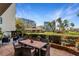 Enjoy waterfront views from this patio with dining and seating areas near the lush lawn at 100 Oakmont Ln # 112, Belleair, FL 33756