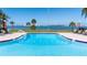 Inviting pool area with ocean views, ideal for swimming and sunbathing with city views at 100 Oakmont Ln # 112, Belleair, FL 33756