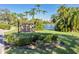 Belleview Biltmore Villas sign with lush landscaping and serene waterfront view at 100 Oakmont Ln # 112, Belleair, FL 33756