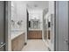 Bathroom with double vanity, walk-in shower, and modern finishes at 1110 25Th N St, St Petersburg, FL 33713