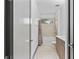 Well-lit bathroom featuring a bathtub, window, wooden vanity, and tiled floors at 1110 25Th N St, St Petersburg, FL 33713