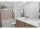 Bathroom featuring a bath tub, shower, and a wooden vanity with sink and mirror at 1110 25Th N St, St Petersburg, FL 33713