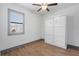 This bedroom features light-colored walls, stylish flooring, and a window for natural light at 1110 25Th N St, St Petersburg, FL 33713