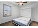 This bedroom features stylish flooring, a window for natural light, and a murphy bed at 1110 25Th N St, St Petersburg, FL 33713