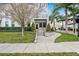 Inviting entrance with landscaped walkway leading to the front door at 1110 25Th N St, St Petersburg, FL 33713