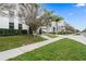 Street view of modern townhomes with manicured lawns, sidewalks, and lush landscaping at 1110 25Th N St, St Petersburg, FL 33713