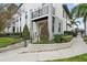 Contemporary townhome exterior with well-maintained landscaping and private balcony at 1110 25Th N St, St Petersburg, FL 33713