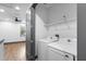 Washer and dryer in a laundry room with overhead storage, perfect for a modern home at 1110 25Th N St, St Petersburg, FL 33713