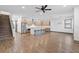 Open-concept living room and kitchen with stainless steel appliances and large island with seating at 1110 25Th N St, St Petersburg, FL 33713