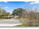 Neighborhood street view showcasing sidewalks, green spaces, and a glimpse of colorful homes at 1110 25Th N St, St Petersburg, FL 33713