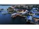 Aerial view of a waterfront community with private docks, pools, and well-manicured lawns at 119 Carlyle Cir, Palm Harbor, FL 34683