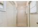 A bright bathroom featuring a glass-enclosed shower, offering a clean and functional space at 119 Carlyle Cir, Palm Harbor, FL 34683