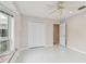 Bright bedroom with ample natural light, ceiling fan, and an inviting space for relaxation and rest at 119 Carlyle Cir, Palm Harbor, FL 34683