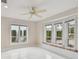 Bright bedroom with large windows, built-in seating and plenty of natural light for a relaxing space at 119 Carlyle Cir, Palm Harbor, FL 34683