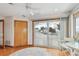 Bedroom with access to the deck and waterfront views from the sliding glass door at 119 Carlyle Cir, Palm Harbor, FL 34683