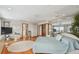 Spacious primary bedroom features a large bed, mirrored wall, and views of the water at 119 Carlyle Cir, Palm Harbor, FL 34683