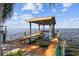 Well-maintained boat dock with lift, offering direct water access for boating and water sports activities at 119 Carlyle Cir, Palm Harbor, FL 34683