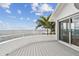 Deck with a view and a sliding glass door leading into the house at 119 Carlyle Cir, Palm Harbor, FL 34683