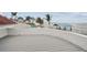 Waterfront deck with view of a dock and boat lift on a cloudy day at 119 Carlyle Cir, Palm Harbor, FL 34683