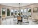 Bright dining area featuring bay windows with waterfront views at 119 Carlyle Cir, Palm Harbor, FL 34683