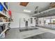 Spacious garage with diamond-patterned floors and ample storage at 119 Carlyle Cir, Palm Harbor, FL 34683