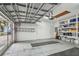 Spacious garage with diamond-patterned floors and ample storage at 119 Carlyle Cir, Palm Harbor, FL 34683