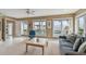 Bright living room with water views, lots of light, and tile floors at 119 Carlyle Cir, Palm Harbor, FL 34683