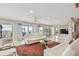 Open living room area with ocean view and white sofas, and a glimpse into a dining room at 119 Carlyle Cir, Palm Harbor, FL 34683