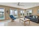 Cozy living room with water views, lots of light, and tile floors at 119 Carlyle Cir, Palm Harbor, FL 34683