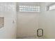 This shower features light tile, glass blocks, and a glass shower door at 119 Carlyle Cir, Palm Harbor, FL 34683