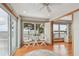 Sitting area with hardwood floors, ceiling fan, and water views at 119 Carlyle Cir, Palm Harbor, FL 34683