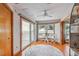 Sitting area with hardwood floors, ceiling fan, and water views at 119 Carlyle Cir, Palm Harbor, FL 34683