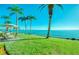 Water view from backyard patio with table and umbrella at 19029 Us Highway 19 N # 29E, Clearwater, FL 33764