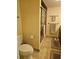 Bathroom featuring a glass door shower with tile walls, a modern toilet, and neutral decor at 19029 Us Highway 19 N # 29E, Clearwater, FL 33764