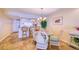 Dining room showcases a glass-top table with seating for six, complemented by a chandelier at 19029 Us Highway 19 N # 29E, Clearwater, FL 33764