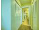 Hallway with access to a bathroom and closet space for convenient storage at 19029 Us Highway 19 N # 29E, Clearwater, FL 33764