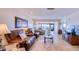 Inviting living room with leather seating, a scenic water view, and tile flooring at 19029 Us Highway 19 N # 29E, Clearwater, FL 33764