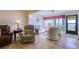 Comfortable living room with waterfront view, offering cozy seating and ample natural light at 19029 Us Highway 19 N # 29E, Clearwater, FL 33764