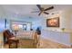 Bright living room featuring comfortable seating and scenic water views from the window at 19029 Us Highway 19 N # 29E, Clearwater, FL 33764