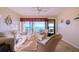 Inviting living room with a large window offering expansive water view at 19029 Us Highway 19 N # 29E, Clearwater, FL 33764