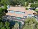 Stunning aerial shot featuring a screened in pool and fenced yard at 1975 Levine Ln, Clearwater, FL 33760